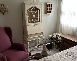 antiqued desk, wine colored accent recliner, curio shelf