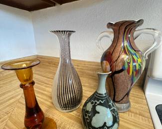 Various glass and pottery vases.
