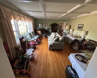 Front living room, to the left of the front door entrance. 