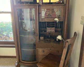 Beautiful antique oak secretary with curved glass