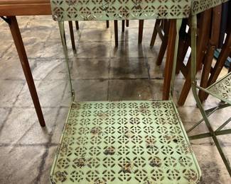One of 4 metal outdoor chairs