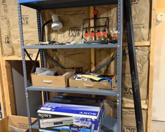 Storage shelves, coolers, table lamps, DVD player, tools