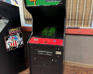 Vintage arcade game as-is located in another building onsite. $100