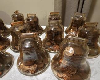 Vintage liberty bell banks filled with coins