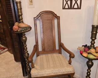 Arm Chair of Dining Room Table - 2 Tall Brass Candlesticks- Marble Fruit