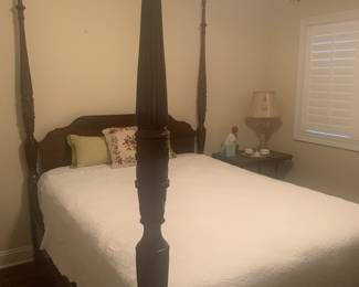 Queen size four poster bed adds warmth and romance to any bedroom