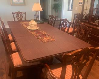 Dining table includes 10 chairs…leaves and table pads. Just in time for the holidays and room enough for everyone!