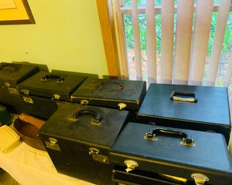 there are seven Singer Featherweight sewing machines--one is missing a case PLUS we have a child's Featherweight still in the box