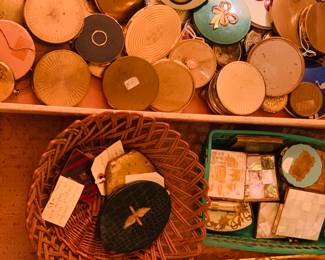 there are at least 150 compacts plus about 75 vintage rouge compacts and turn of the last century powder boxes