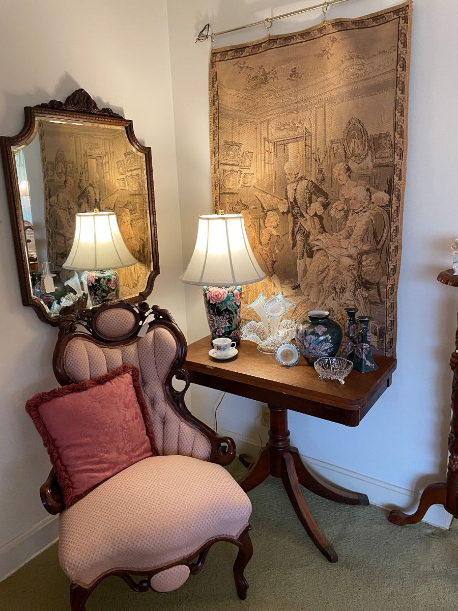 View of entry with Victorian chair and mahogany game table
