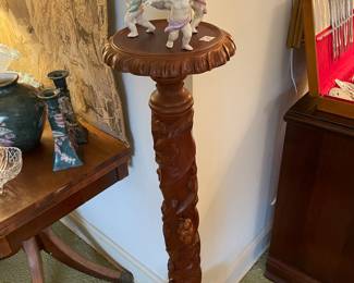 Carved mahogany stand with Dresden cherub bowl