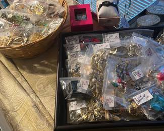 Large collection of costume pins and earrings and designer watches
