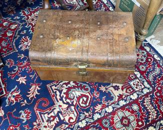 Old steel Victorian trunk and nice oriental rug