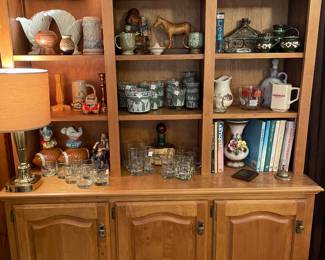 Built in bookcase of bar collectibles and etc