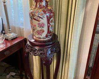 One of a pair of Oriental stands and one of a pair of Oriental vases