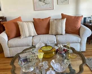 Sofa with pillows and art work