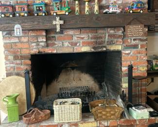 Fun child's train and cars made from red clay in Mexico, iron fireplace grid, match collection in baskets