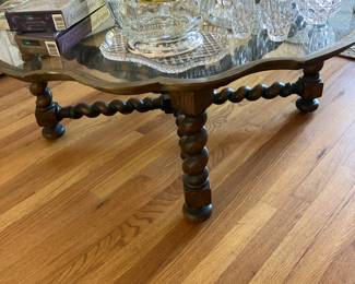 Glass top brass rimmed coffee table with wood base, cut glass accessories and serving pieces