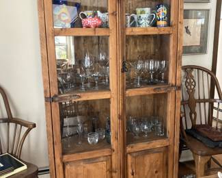 Rustic Display Cabinet filled with bar ware