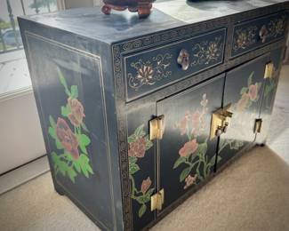 Black lacquer chinoiserie chest with brass fittings