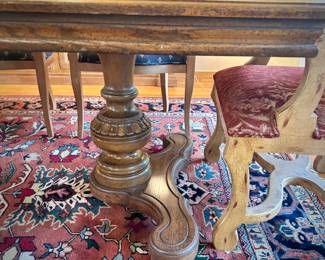 Table and 8 chairs. Table made in North Carolina. Six upholstered low chairs and two red upholstered grandfather chairs.