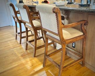 Four wood barstools with trim