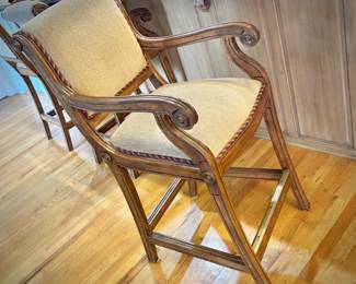 Four wood barstools with trim