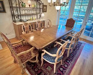 Table and 8 chairs. Table made in North Carolina. Six upholstered low chairs and two red upholstered grandfather chairs.