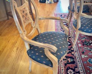 Table and 8 chairs. Table made in North Carolina. Six upholstered low chairs and two red upholstered grandfather chairs.