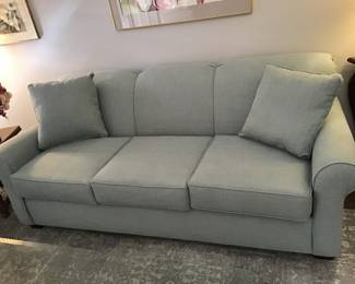 Attractive soft green 78 inch x 35 deep x 38 high couch with two pillows. Used rarely and in brand new condition. $400 - 50% off original value