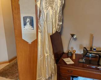 Stunning wedding gown comes with picture of the bride in the dress (hanging on door next to it) plus extras.