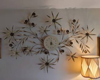 Gold tone mid century modern wall clock.