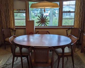 Red Lion Table Co. Too much glare, you can't see the beautiful design in the middle of the table. (and no, the light fixture is not for sale.)  Those cane back chairs and the table are  in perfect shape also.  The fabric could use a cleaning.