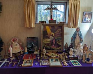 Religious items including Infant of Prague.