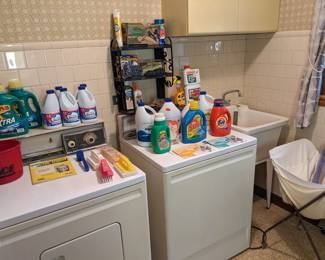 Cleaning supplies and vintage laundry basket.