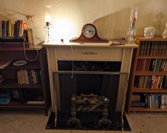 Fireplace, mantle clock, crystal candle holders.