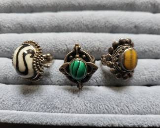 Vintage southwestern sterling and cats eye , malachite , and unknown rings.