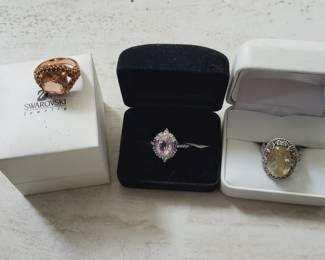 Swarovski and Pandora rings.