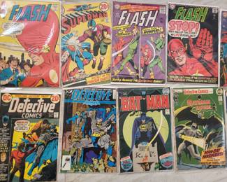 Vintage batman , superman , and flash comic books.