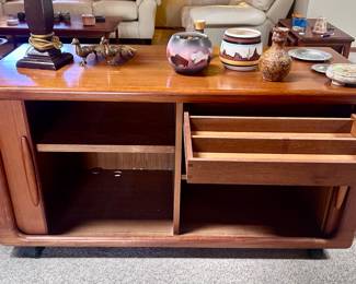Mid century modern wood console table with sliding storage drawers and sliding door