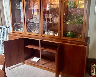 Wood display cabinet with lights and glass display cabinet doors. Lots of room for storage in lower cabinets