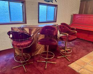 Velvet red swiveling bar chairs