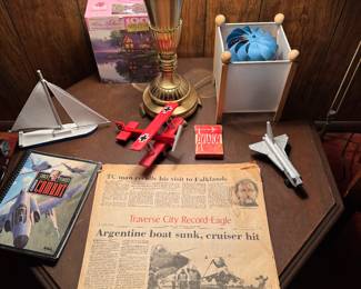 Planes, boats, spaceships, playing cards, newspaper, lamps and a random puzzle.  Don’t think too hard on the thread, sometimes we just decorate. 