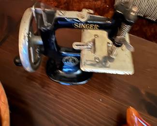 After so many pictures your eyes may be getting tired, but don’t worry, this picture of a teeny tiny Singer Sewing machine is indeed blurry!