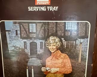 No, it’s not a wig, it’s a serving tray-still new in  box.