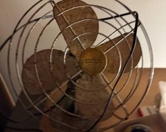 This is a terrible photo of a cool, vintage (and dangerous) fan.