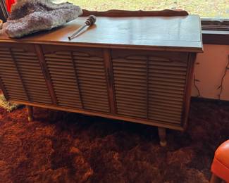 This is a vintage console record player. Yes we have records!