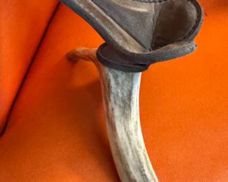 Little leather chair on antlers 