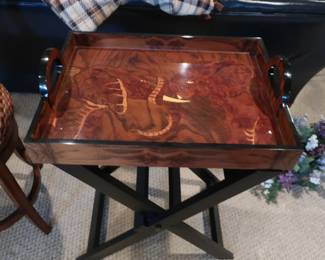 There  is  a  picture of two  elephants  on  top  of  the  serving table.