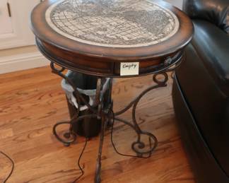 Round table  with  map  design on  top.